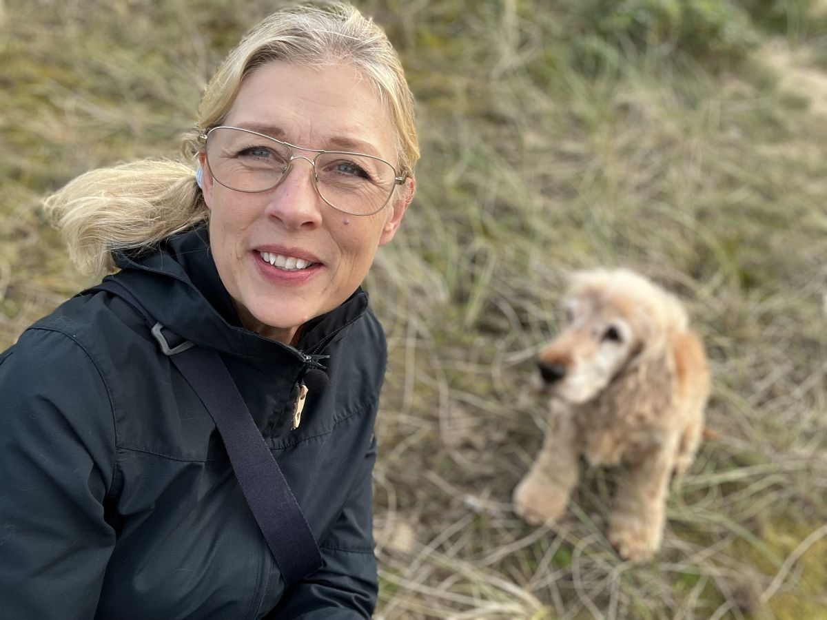 Author enjoying her free time outdoors with her cocker spaniel